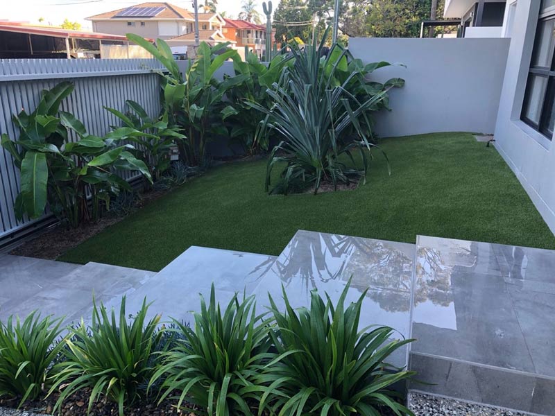 Synthetic turf in sloping front yard